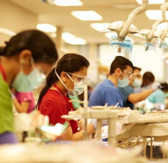 Students wearing masks in a lab