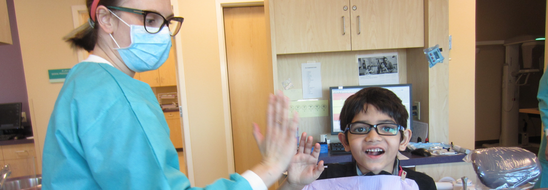 dentist giving a child a high-five