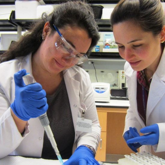 two students using a syringe