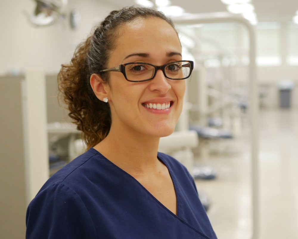 woman dentist smiling at the camera