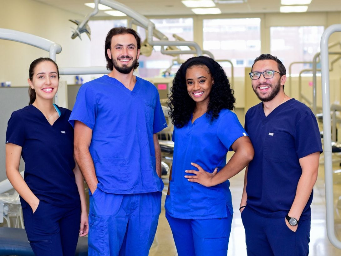 group of dentists smiling to camera