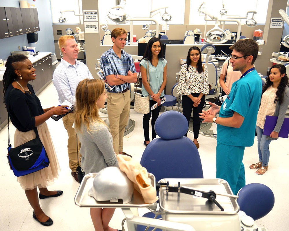 prospective students listening to dentist