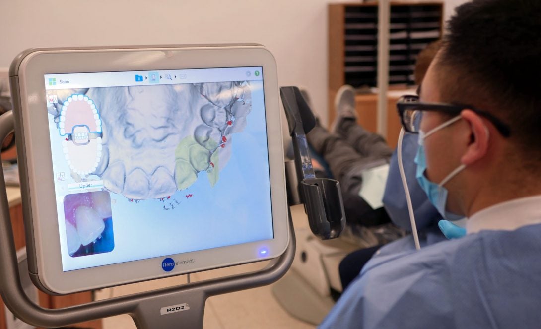 Dentist studying virtual dental model