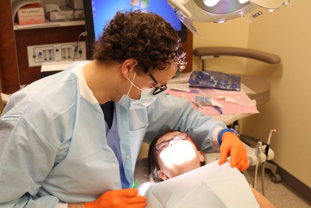 dentist working with child patient