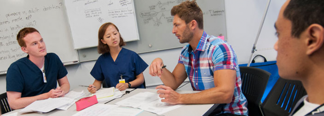 group sitting at conference table