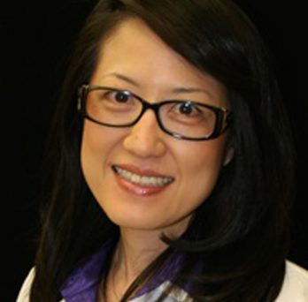 Dr Judy Yuan headshot in white coat 