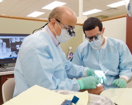 dentists working on patient