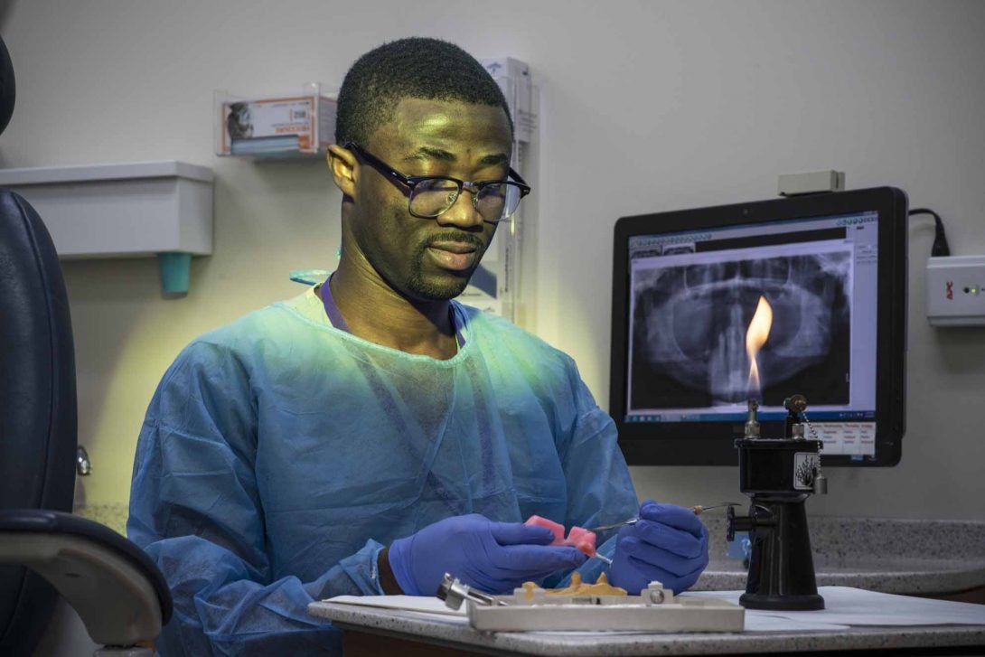 two dentists looking at computer screen