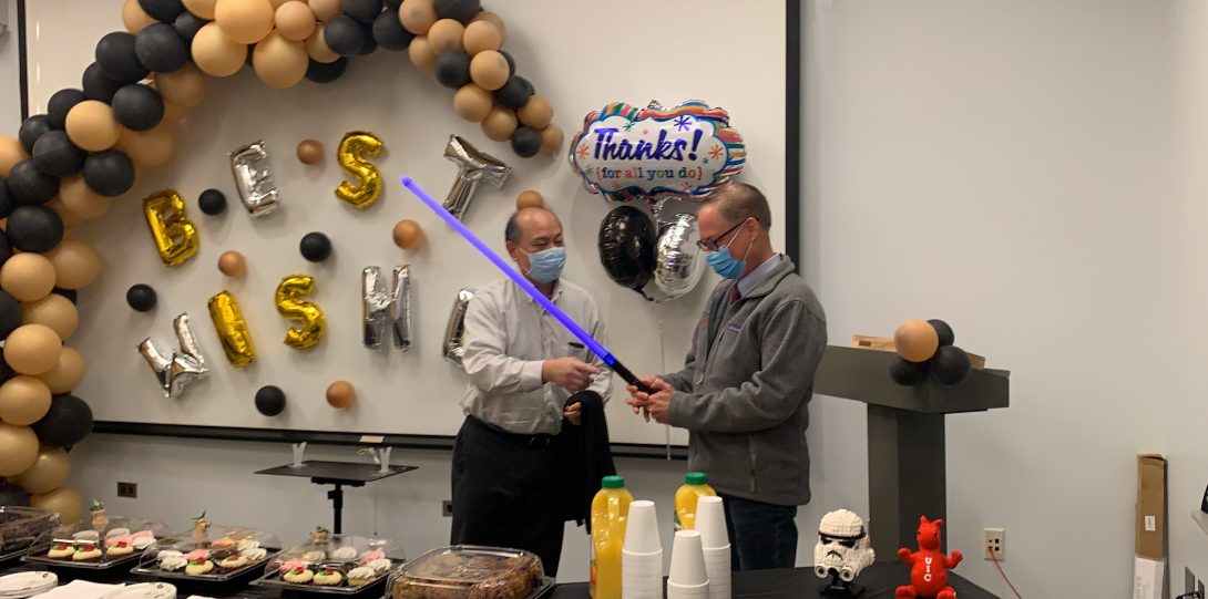 Dr. Budi Kusnoto handed a light saber to Dean Stanford as a symbol of the “Force”