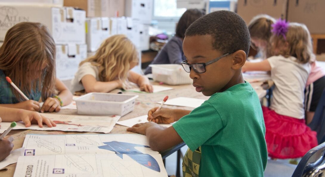 Child doing work in school