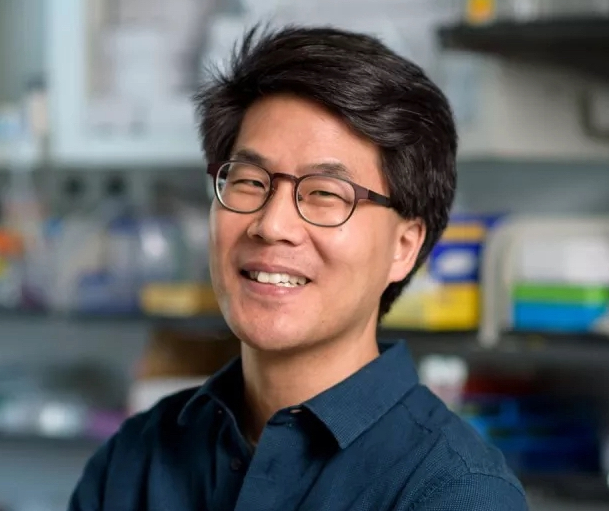 Eric Lai smiling in lab