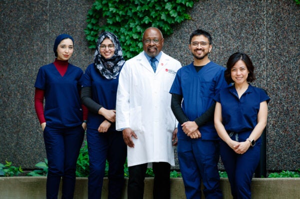 Dentistry students and faculty member