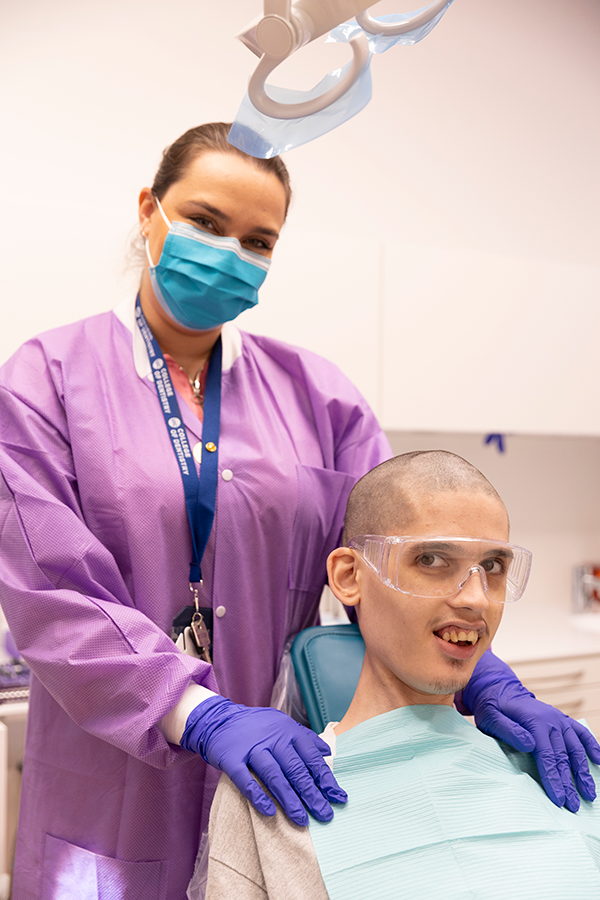 Patient with clinic faculty at ICC